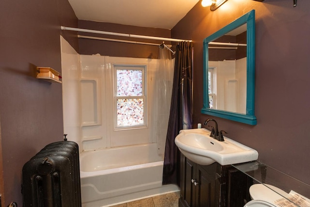 2912 15th Ave S, Minneapolis, MN 55407 - full bath featuring radiator, vanity, shower / bath combo, and tile patterned floors