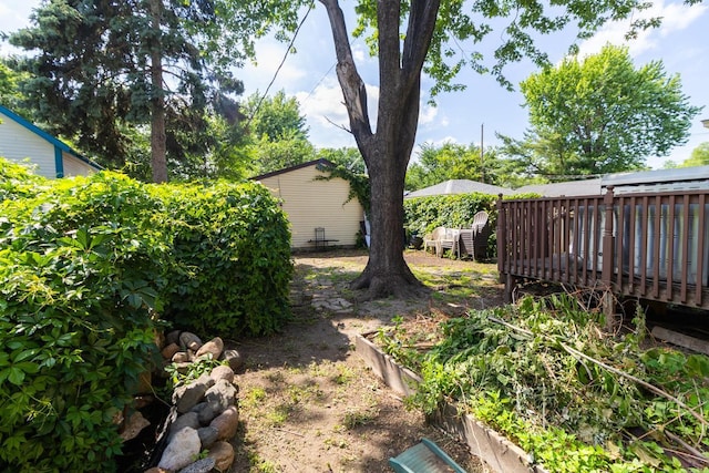 2912 15th Ave S, Minneapolis, MN 55407 - view of yard featuring a vegetable garden and a wooden deck