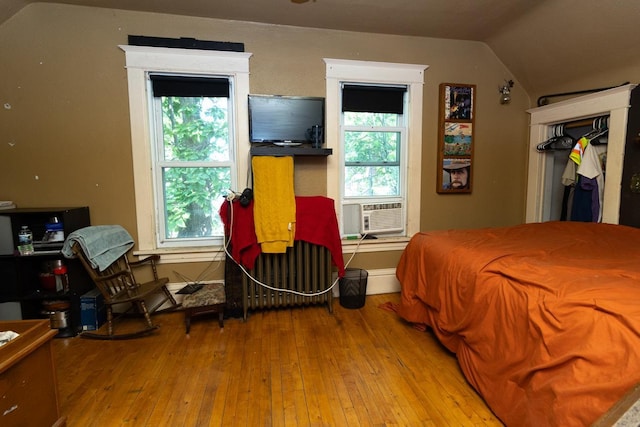 2912 15th Ave S, Minneapolis, MN 55407 - bedroom with hardwood / wood-style flooring, lofted ceiling, and cooling unit