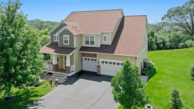 18837 Javelin Way, Lakeville, MN 55044 - craftsman-style house featuring asphalt driveway, a porch, a garage, a front lawn, and roof with shingles