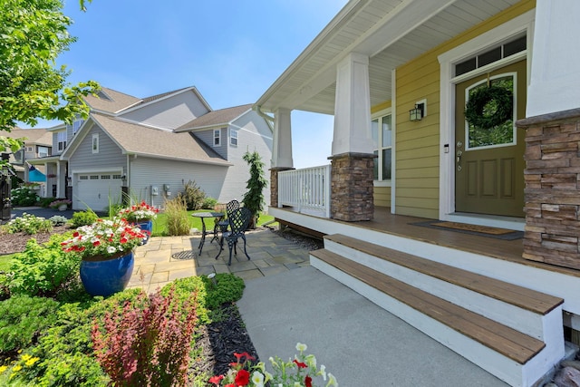 18837 Javelin Way, Lakeville, MN 55044 - entrance to property featuring covered porch, a garage, and stone siding