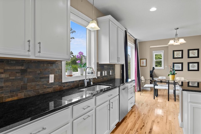 18837 Javelin Way, Lakeville, MN 55044 - kitchen featuring stainless steel dishwasher, decorative backsplash, light wood-type flooring, white cabinetry, and pendant lighting