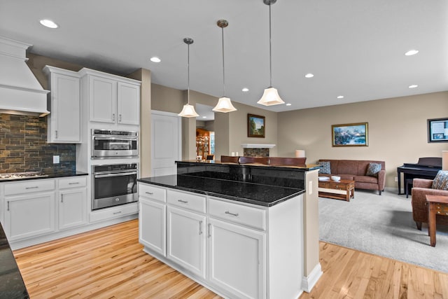 18837 Javelin Way, Lakeville, MN 55044 - kitchen featuring open floor plan, light wood-style floors, backsplash, white cabinetry, and recessed lighting