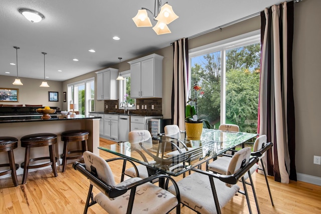 18837 Javelin Way, Lakeville, MN 55044 - dining area featuring light wood-type flooring, recessed lighting, and a chandelier