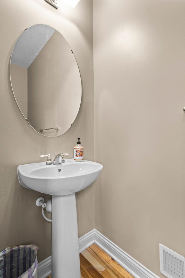 18837 Javelin Way, Lakeville, MN 55044 - bathroom with baseboards and wood finished floors