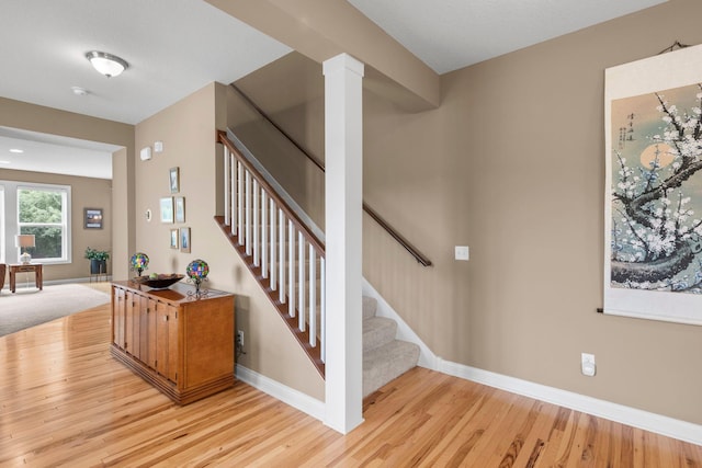 18837 Javelin Way, Lakeville, MN 55044 - staircase with wood finished floors and decorative columns