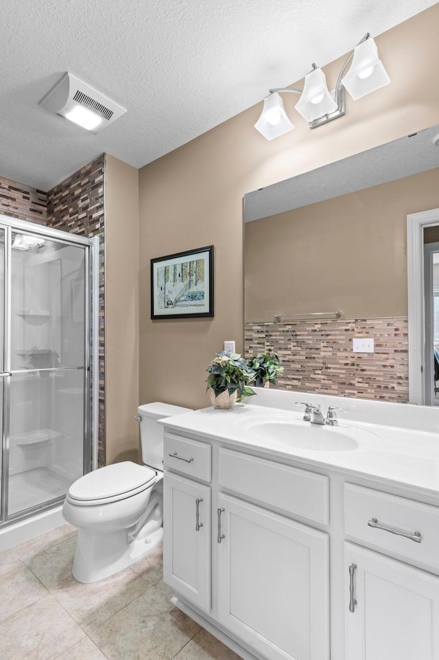 18837 Javelin Way, Lakeville, MN 55044 - bathroom with vanity, a stall shower, tile patterned floors, and a textured ceiling