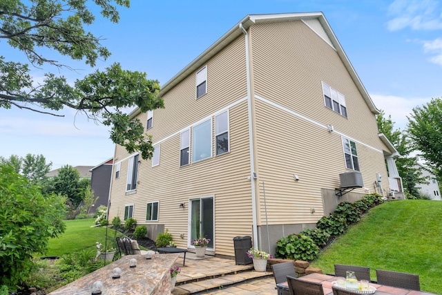 18837 Javelin Way, Lakeville, MN 55044 - rear view of property featuring a patio area and a lawn