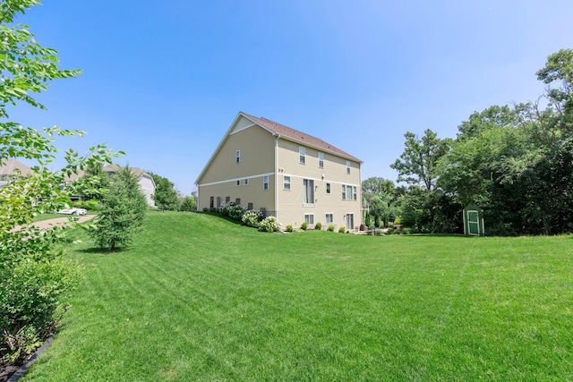 18837 Javelin Way, Lakeville, MN 55044 - view of green lawn featuring a shed