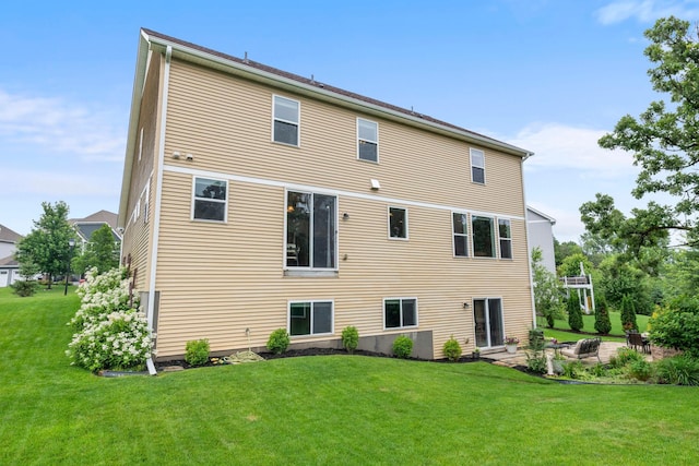 18837 Javelin Way, Lakeville, MN 55044 - rear view of house featuring a lawn and a patio