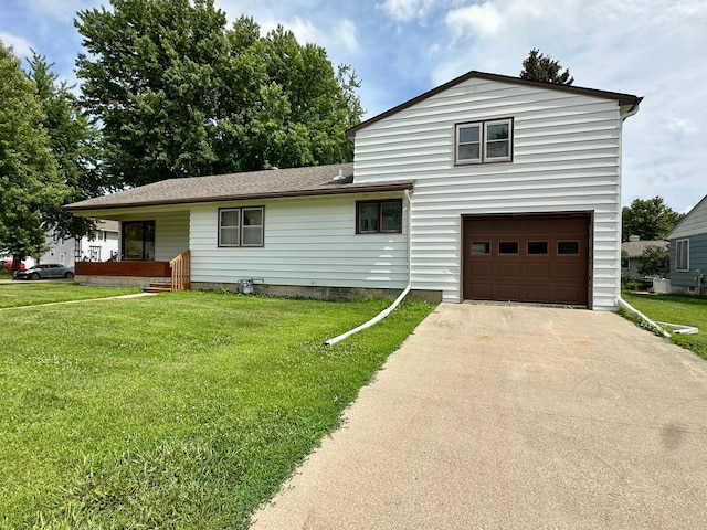 1224 Duba St, Worthington, MN 56187 - tri-level home with a garage, concrete driveway, and a front yard