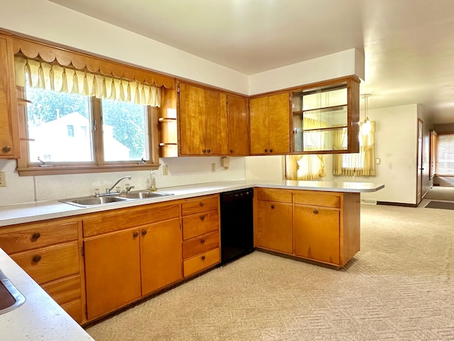1224 Duba St, Worthington, MN 56187 - kitchen featuring black dishwasher, light countertops, and plenty of natural light