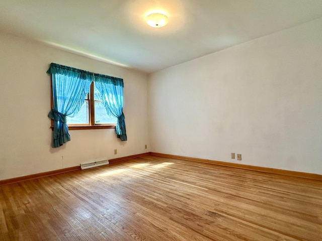 1224 Duba St, Worthington, MN 56187 - unfurnished room with wood finished floors and baseboards