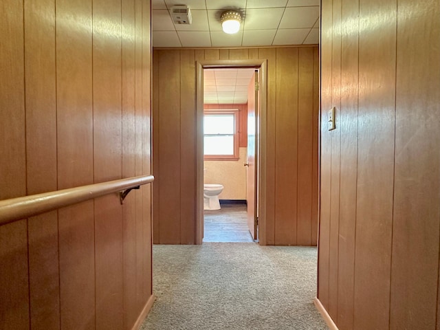1224 Duba St, Worthington, MN 56187 - hallway featuring carpet flooring and wood walls