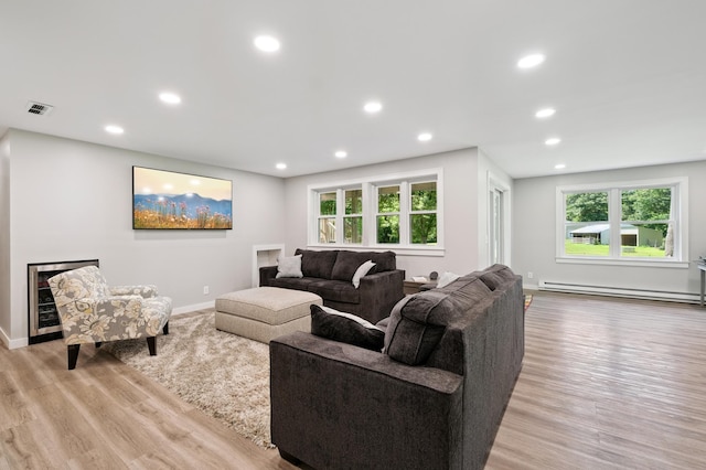 22470 Raven St NW, Oak Grove, MN 55011 - living area with a baseboard radiator, recessed lighting, and light wood-style flooring