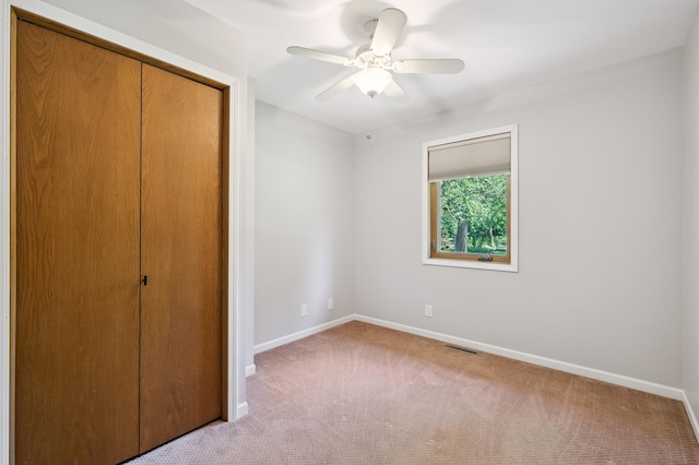 22470 Raven St NW, Oak Grove, MN 55011 - unfurnished bedroom featuring a closet, carpet, and ceiling fan