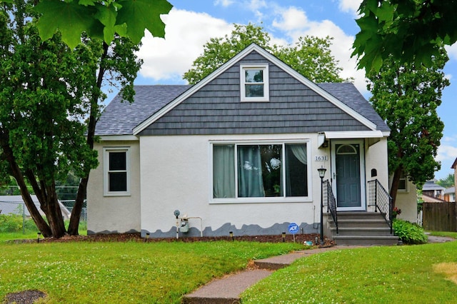 1631 Ross Ave, Saint Paul, MN 55106 - bungalow featuring stucco siding and roof with shingles