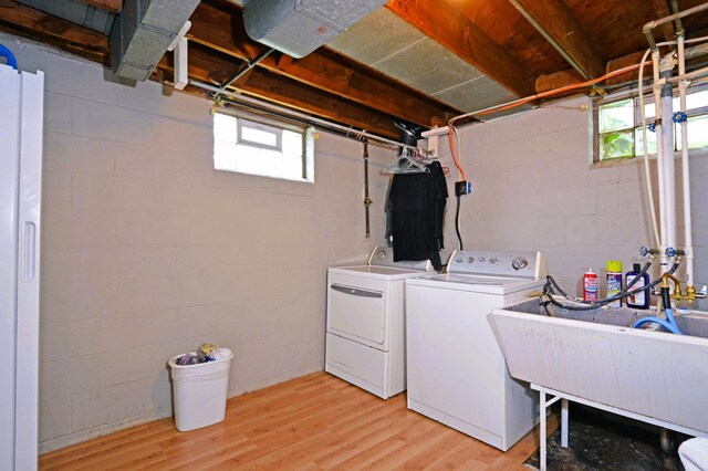 1631 Ross Ave, Saint Paul, MN 55106 - washroom featuring washer and dryer and light wood-type flooring