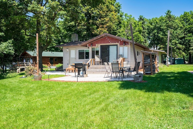 46317 Lucretia Ln, Isle, MN 56342 - rear view of property with a patio, a lawn, and a chimney