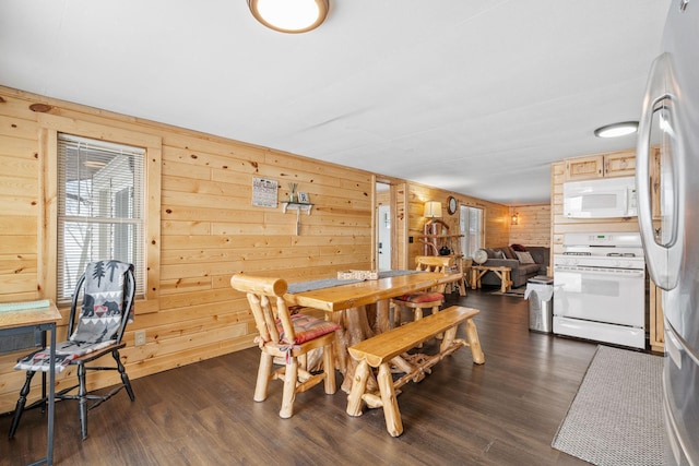 46317 Lucretia Ln, Isle, MN 56342 - dining area featuring wood walls and dark wood-type flooring