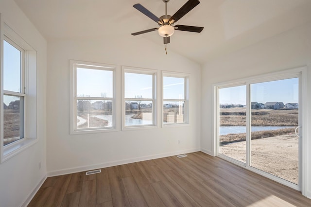 20145 114th Ave, Rogers, MN 55311 - unfurnished sunroom featuring healthy amount of natural light, a water view, and vaulted ceiling