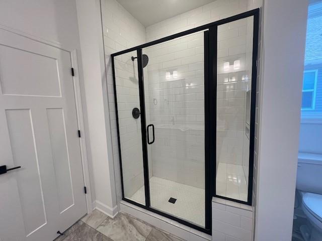 20145 114th Ave, Rogers, MN 55311 - bathroom featuring a stall shower and marble finish floors