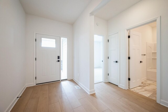 20145 114th Ave, Rogers, MN 55311 - entryway with light wood finished floors and baseboards