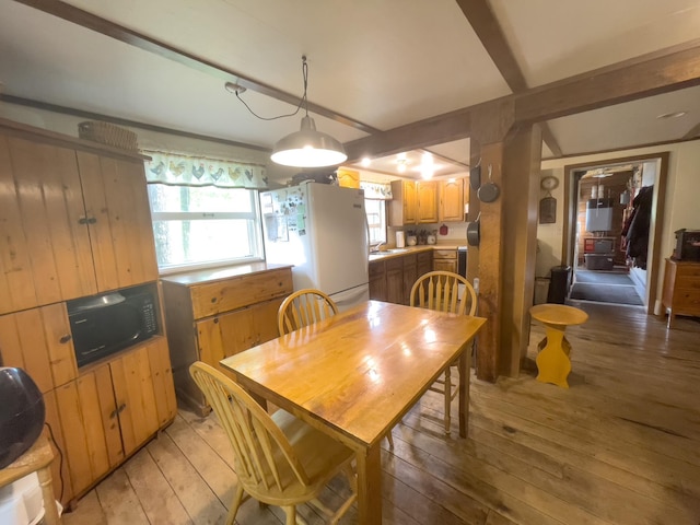 5566 Little Marais Rd, Crystal Bay Twp, MN 55603 - dining room featuring light wood-type flooring and beam ceiling