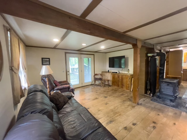 5566 Little Marais Rd, Crystal Bay Twp, MN 55603 - living room featuring wood-type flooring, a wood stove, beam ceiling, and recessed lighting
