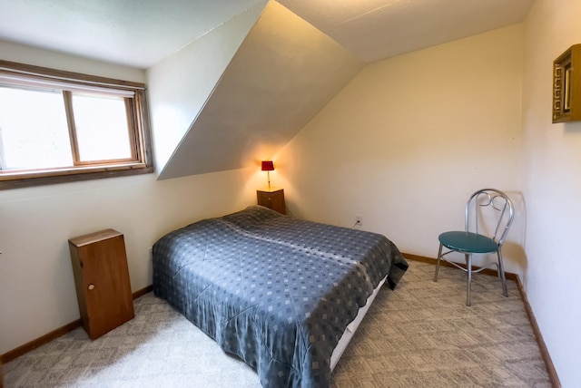 5566 Little Marais Rd, Crystal Bay Twp, MN 55603 - bedroom with carpet floors and lofted ceiling