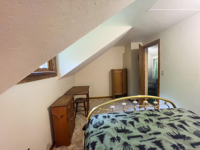 5566 Little Marais Rd, Crystal Bay Twp, MN 55603 - bedroom with light colored carpet and lofted ceiling