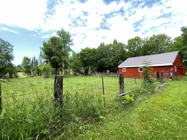 5566 Little Marais Rd, Crystal Bay Twp, MN 55603 - view of grassy yard with an outbuilding and a view of countryside