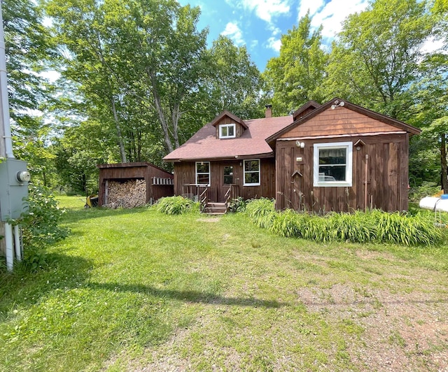 5566 Little Marais Rd, Crystal Bay Twp, MN 55603 - chalet / cabin featuring a front yard and a chimney