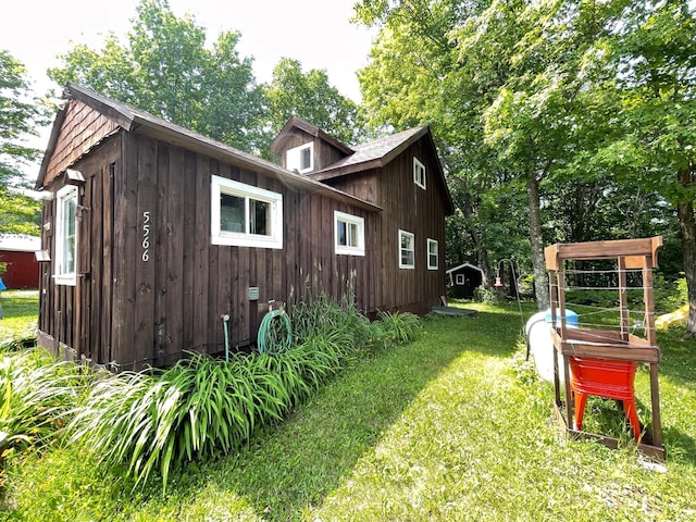 5566 Little Marais Rd, Crystal Bay Twp, MN 55603 - view of side of home with a yard