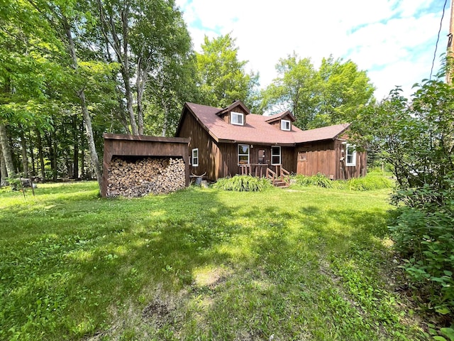 5566 Little Marais Rd, Crystal Bay Twp, MN 55603 - rear view of house with a lawn