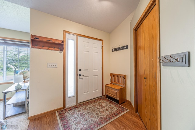 3730 Taylor St S, Fargo, ND 58104 - entrance foyer featuring light wood-type flooring and a textured ceiling