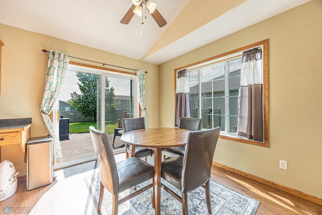3730 Taylor St S, Fargo, ND 58104 - dining room with lofted ceiling, light wood-style flooring, and a ceiling fan