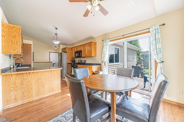 3730 Taylor St S, Fargo, ND 58104 - dining area with light wood-style flooring, lofted ceiling, and a ceiling fan