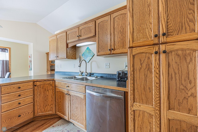 3730 Taylor St S, Fargo, ND 58104 - kitchen featuring dishwasher, vaulted ceiling, a peninsula, light wood-style floors, and brown cabinets