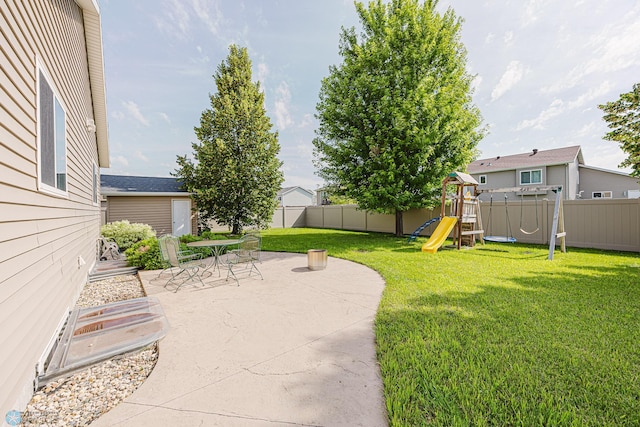 3730 Taylor St S, Fargo, ND 58104 - fenced backyard featuring a patio area and a playground