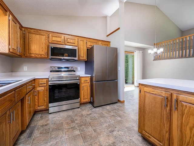 133 Summerfield Ct, Waverly, MN 55390 - kitchen with appliances with stainless steel finishes, high vaulted ceiling, light countertops, brown cabinetry, and pendant lighting