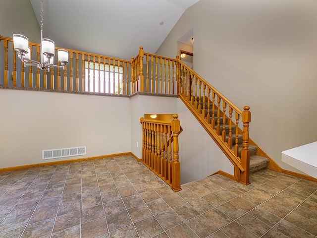133 Summerfield Ct, Waverly, MN 55390 - staircase featuring a chandelier, stone finish flooring, and high vaulted ceiling