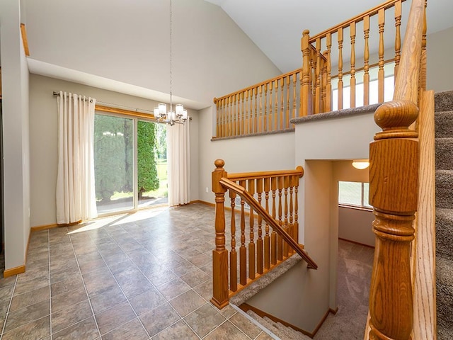 133 Summerfield Ct, Waverly, MN 55390 - stairway with healthy amount of natural light, a chandelier, and high vaulted ceiling