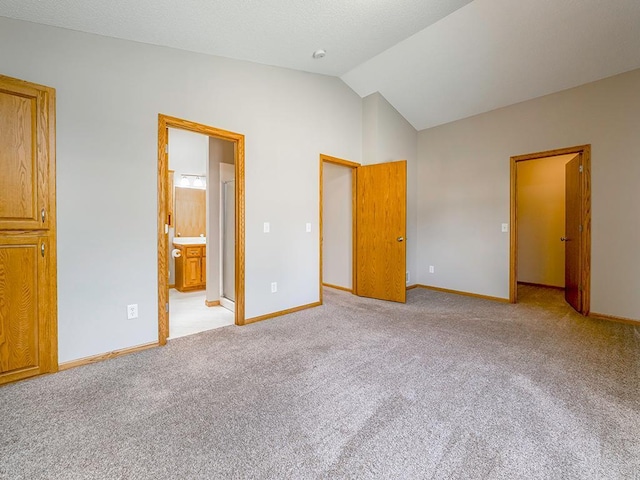 133 Summerfield Ct, Waverly, MN 55390 - unfurnished bedroom with vaulted ceiling, carpet floors, and connected bathroom