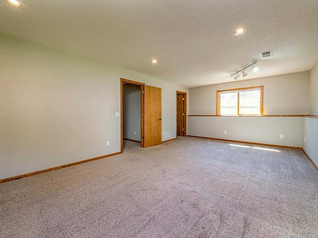133 Summerfield Ct, Waverly, MN 55390 - empty room featuring light carpet, a textured ceiling, and recessed lighting