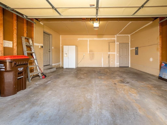 133 Summerfield Ct, Waverly, MN 55390 - garage featuring white fridge with ice dispenser, electric panel, and a garage door opener