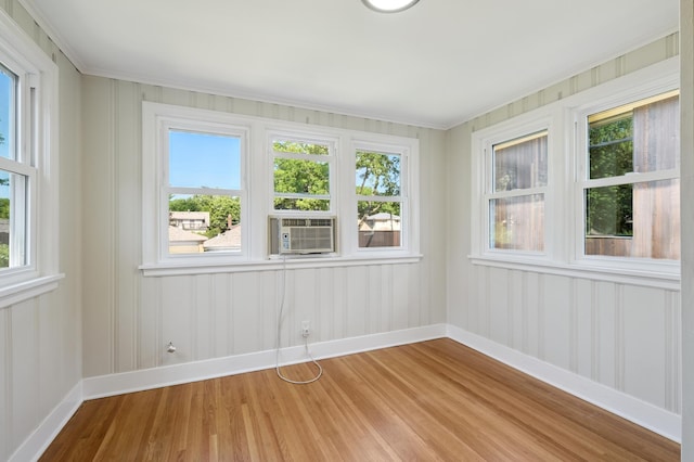 2440 37th Ave S, Minneapolis, MN 55406 - spare room featuring cooling unit, light wood finished floors, plenty of natural light, and crown molding
