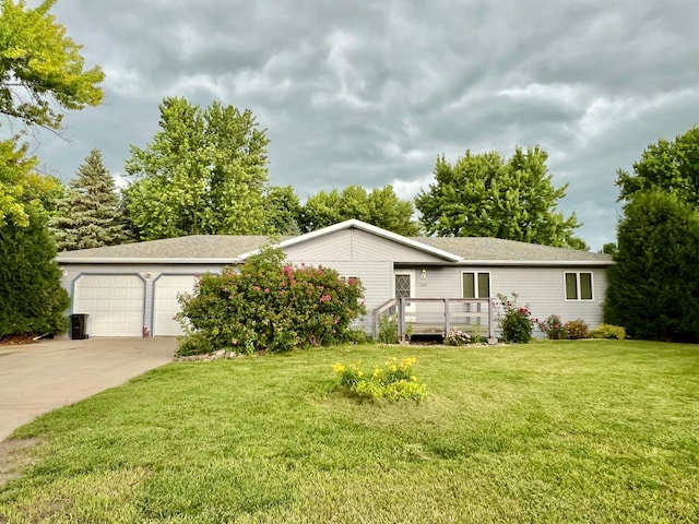 1002 6th Ave N, Wheaton, MN 56296 - view of front of home with an attached garage, driveway, a front lawn, and a shingled roof