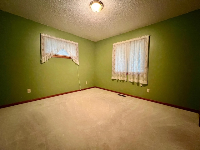 1002 6th Ave N, Wheaton, MN 56296 - carpeted spare room featuring a textured ceiling and baseboards