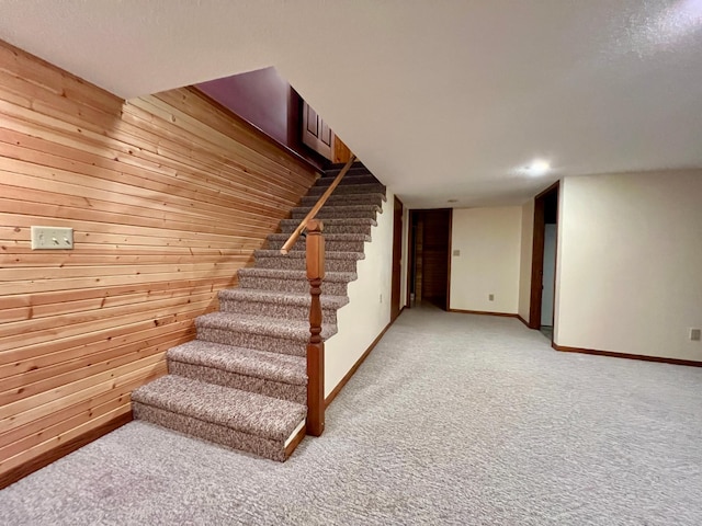 1002 6th Ave N, Wheaton, MN 56296 - stairway with wood walls and carpet flooring